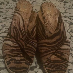Tiger print mules.